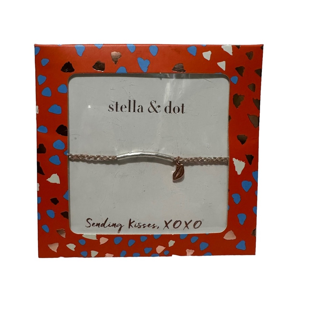 Stella and dot braided silver bracelet with lips charm, in original packaging.